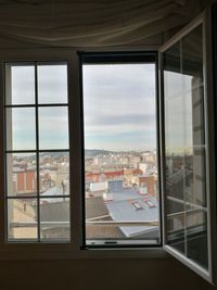 View of cityscape through window