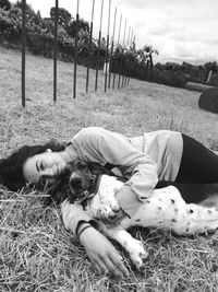 View of dog relaxing on field