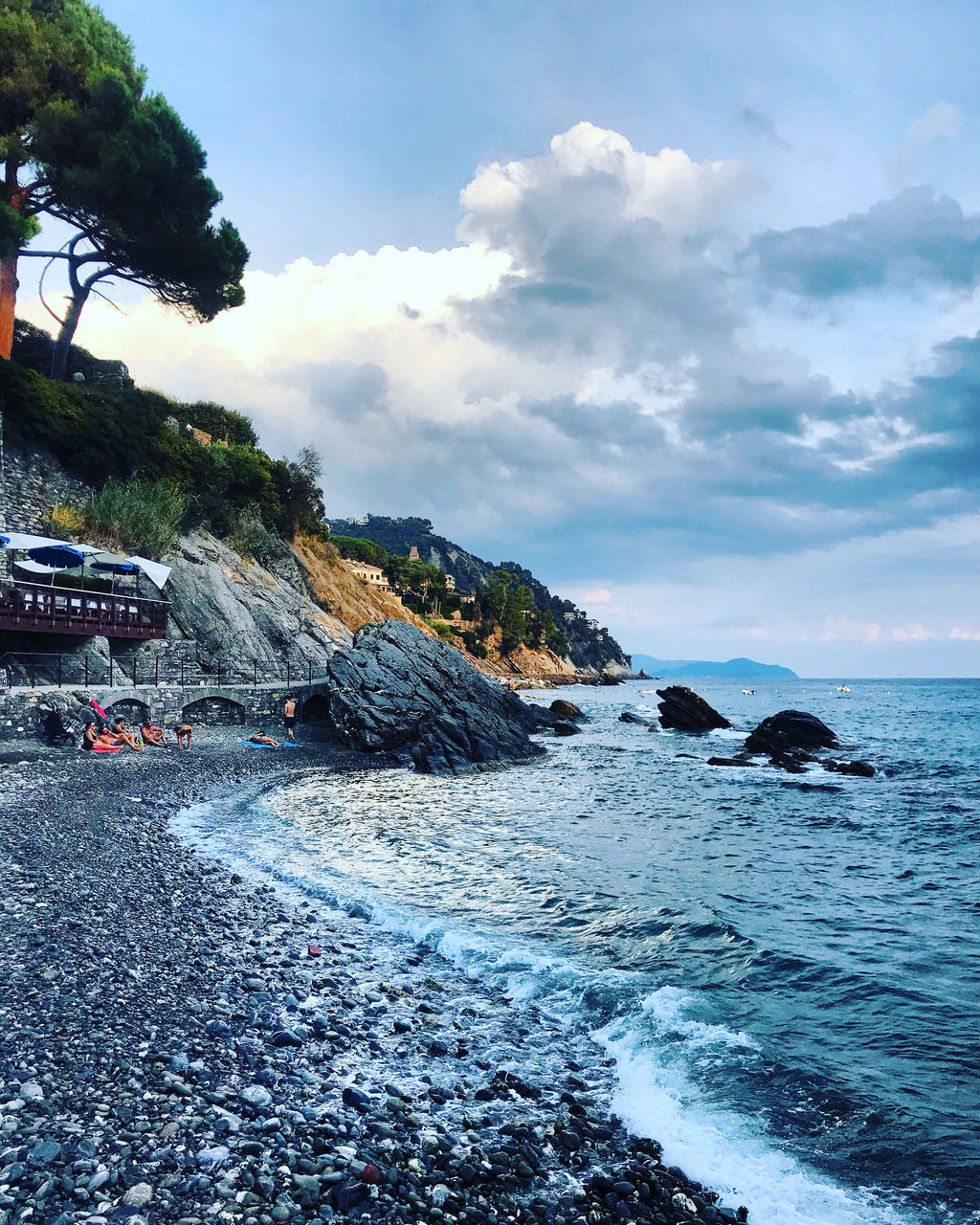 SCENIC VIEW OF ROCKS ON BEACH AGAINST SKY