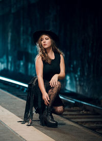 Portrait of beautiful young woman in hat