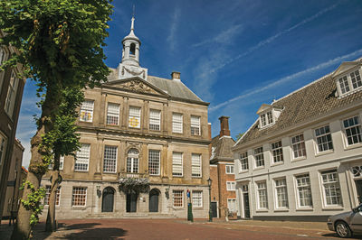 Empty street in front of the city hall building in weesp. a pleasant small village in netherlands.