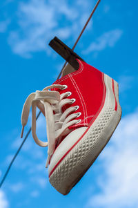 Low angle view of shoe on clothesline