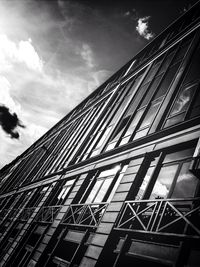 Low angle view of building against cloudy sky