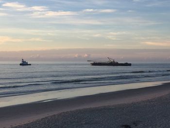 Scenic view of sea against sky during sunset