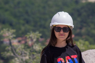 Portrait of young woman wearing hat