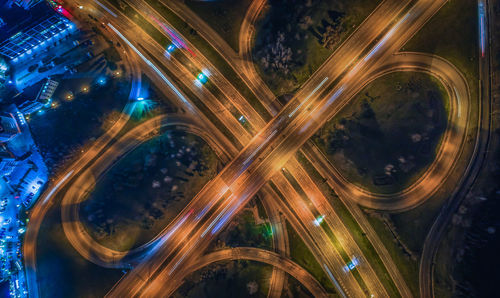 High angle view of light trails on highway at night