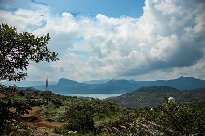 Scenic view of landscape and mountains against sky