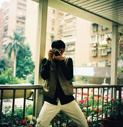 Man photographing at camera