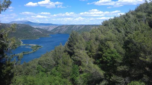 High angle view of river against cloudy sky