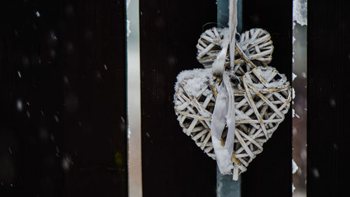 Close-up of window hanging on metal door