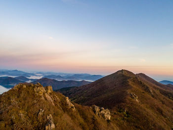 Scenic view of mountains against sky during sunset