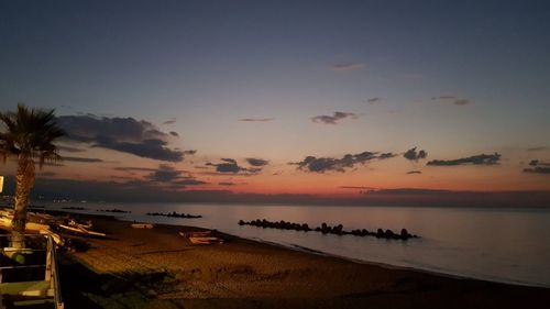 Scenic view of sea against sky at sunset