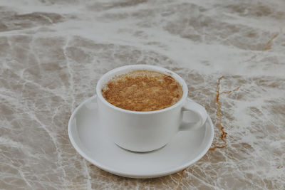 High angle view of coffee cup on table