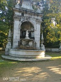 Statue in front of historical building