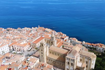 High angle view of townscape by sea