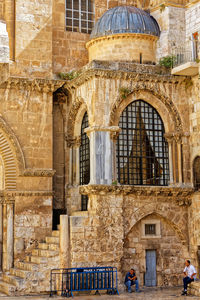 Men sitting by church of the holy sepulchre