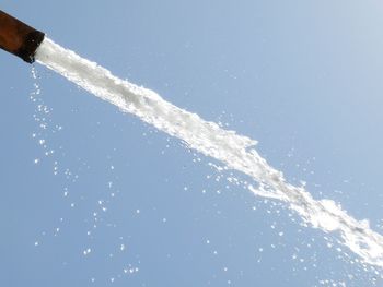 Low angle view of vapor trail