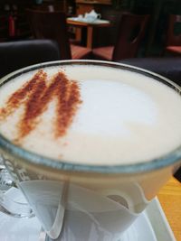 Close-up of cappuccino served on table