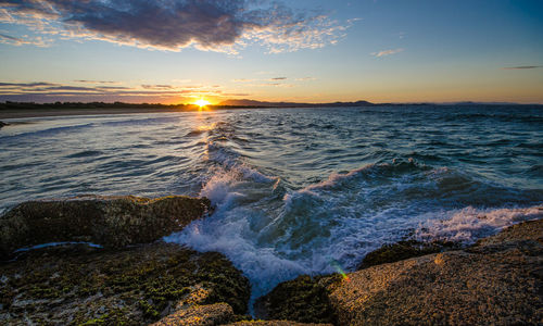 Scenic view of sea at sunset