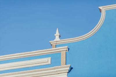 Low angle view of building against clear blue sky