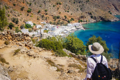 Rear view of man looking away while standing on mountain