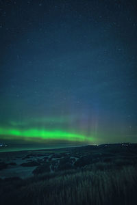 Scenic view of sea against sky at night