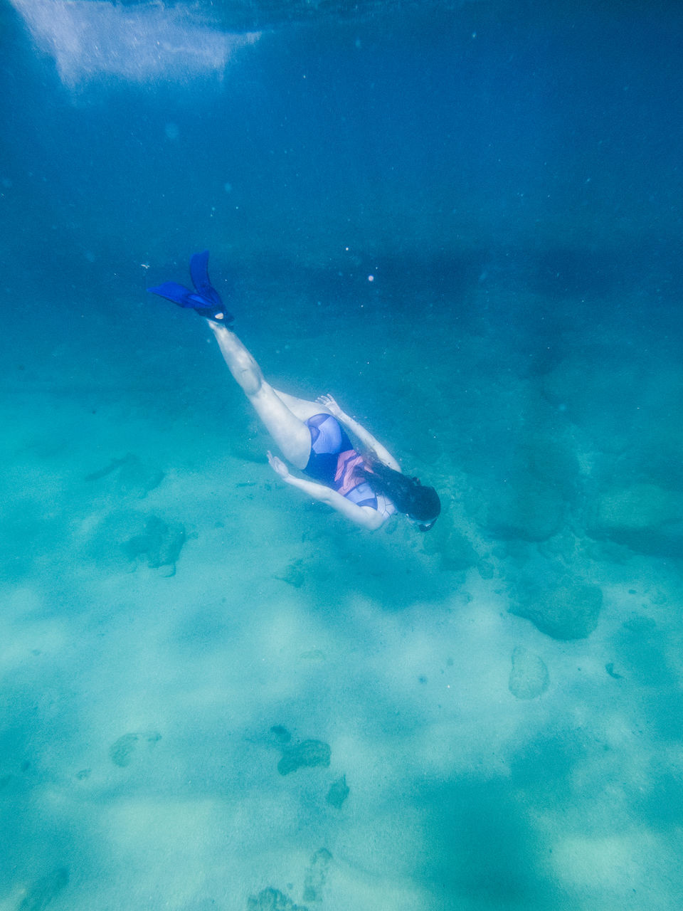 WOMAN SWIMMING IN SEA