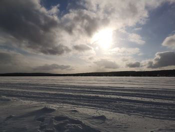 Scenic view of snow field against sky