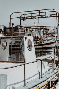 Boats moored at harbor