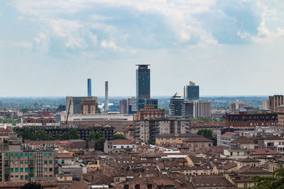 High angle view of buildings in city against sky