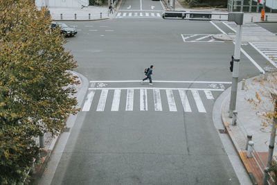 High angle view of boy running on road