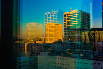 Modern buildings against sky in city