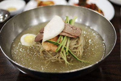 Close-up of noodles soup in bowl on table