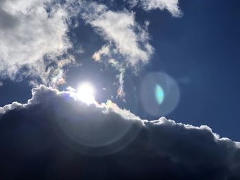 Low angle view of sun in sky