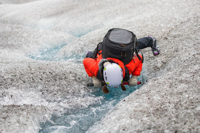 High angle view of person with umbrella on snow