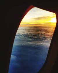 Close-up of sea seen through airplane window