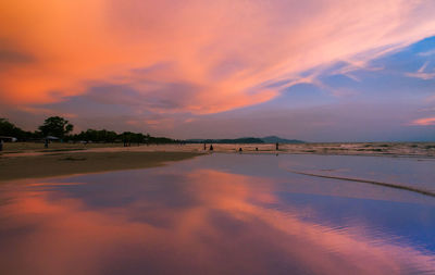 Scenic view of sea against romantic sky at sunset