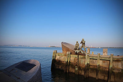 Scenic view of sea against clear blue sky