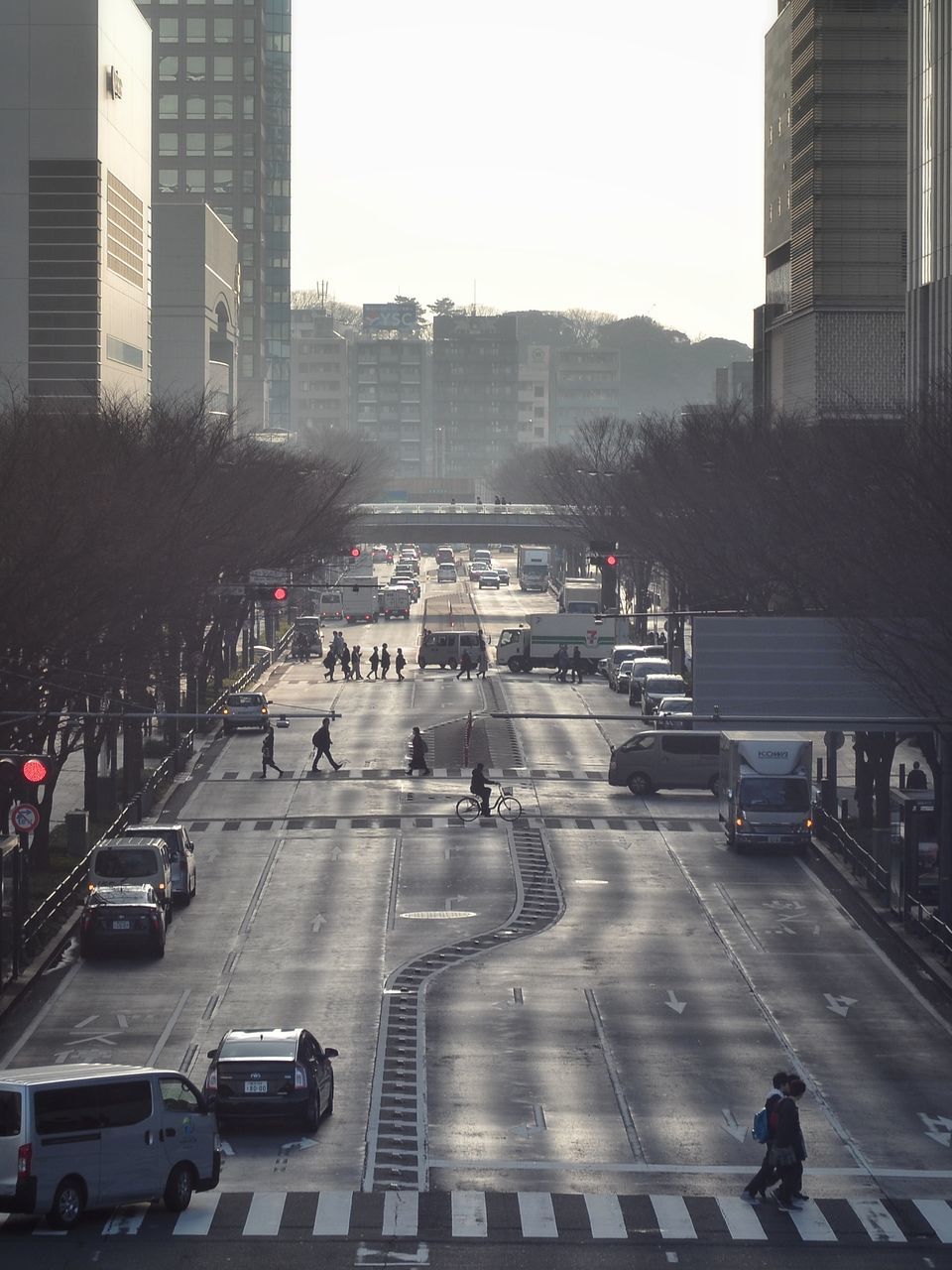 city, city street, building exterior, transportation, city life, outdoors, day, architecture, red light, people, skyscraper