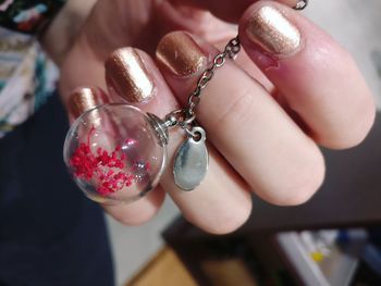 Cropped hand holding locket