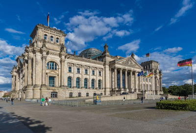 Facade of historical building against blue sky