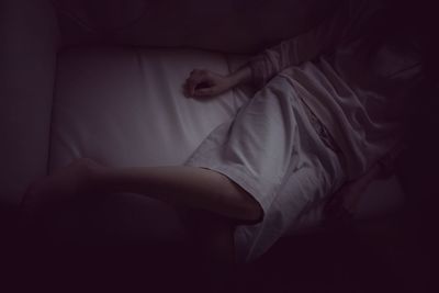 Woman sleeping on bed