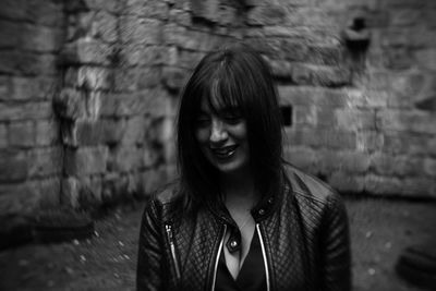 Close-up of smiling mature woman standing outdoors