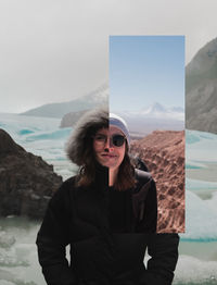 Portrait of a smiling young woman standing on mountain