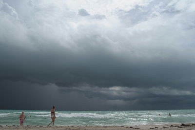 Scenic view of sea against cloudy sky