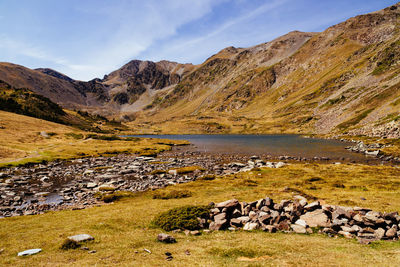 Scenic view of lake and mountains against sky