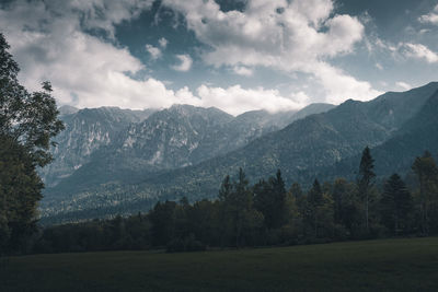 Scenic view of landscape and mountains against sky