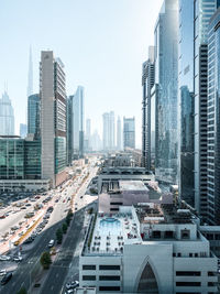 Modern buildings in city against clear sky