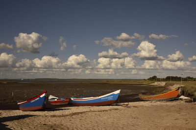 View of beach against cloudy sky