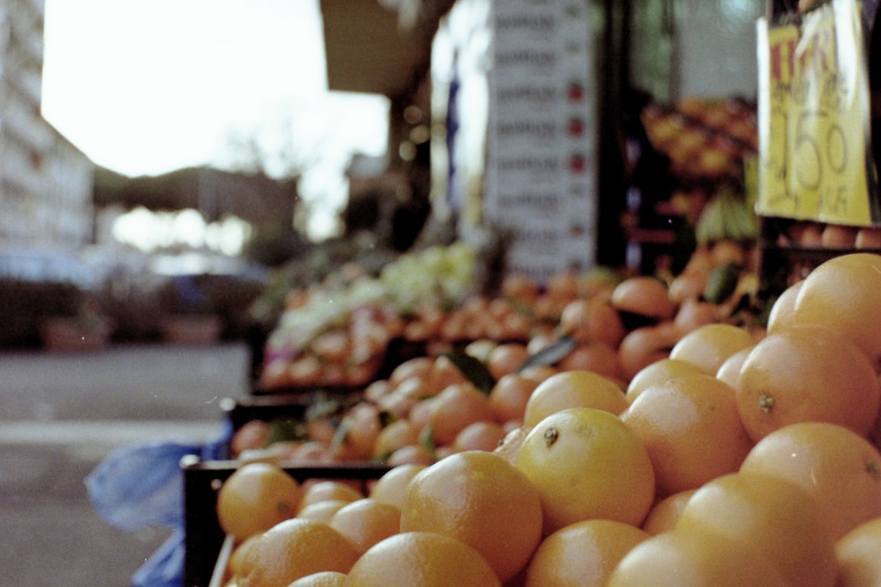 CLOSE-UP OF FRUITS AT MARKET STALL